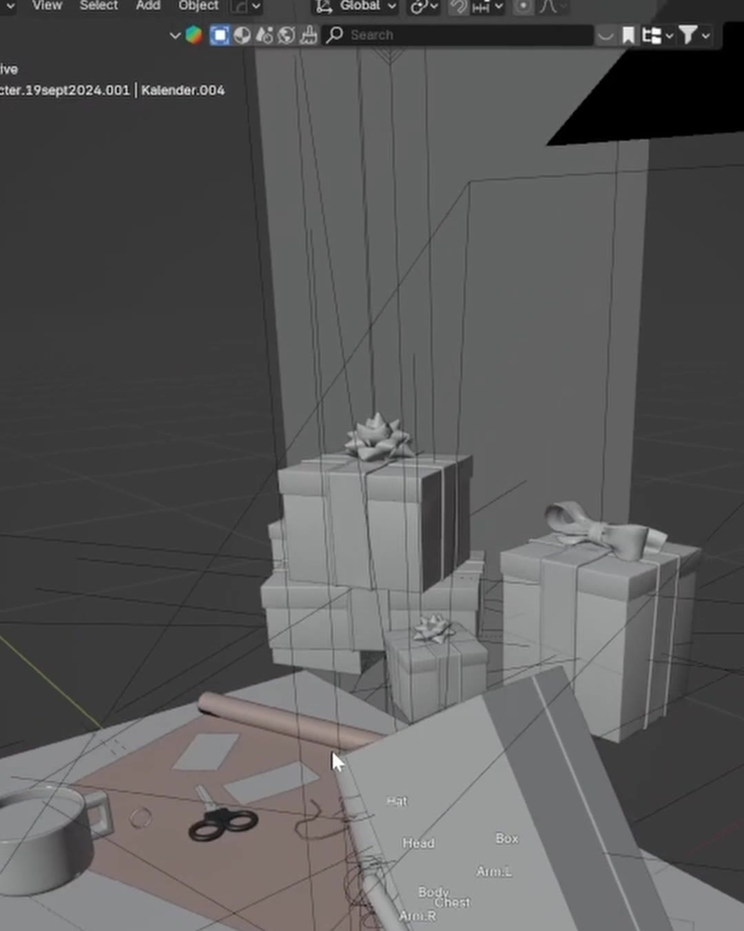 Presenter, en pappersrulle och en sax som gråa 3D-modeller i Blender